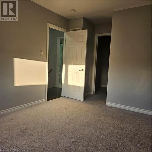 View of carpeted spare room - 39 Appleby Street, Kitchener, ON - Indoor Photo Showing Other Room