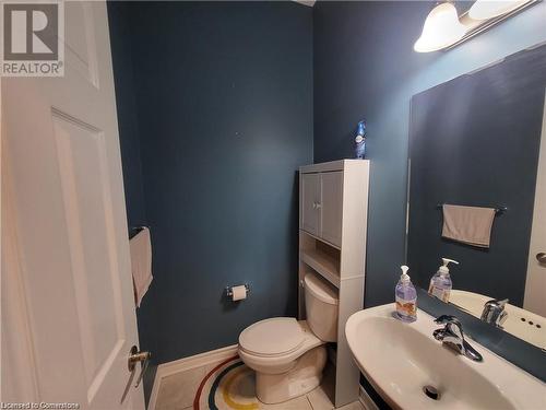 Bathroom featuring tile patterned flooring, sink, and toilet - 39 Appleby Street, Kitchener, ON - Indoor Photo Showing Bathroom