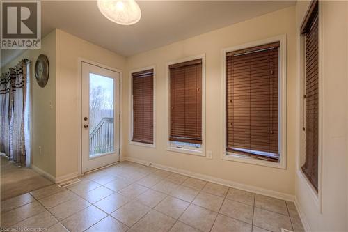 Doorway with light tile patterned flooring - 66 Abbott Crescent, Cambridge, ON - Indoor Photo Showing Other Room