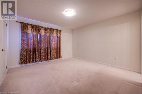 View of carpeted empty room - 66 Abbott Crescent, Cambridge, ON - Indoor Photo Showing Other Room