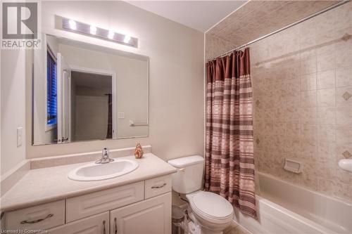 Full bathroom with toilet, vanity, and shower / bath combination with curtain - 66 Abbott Crescent, Cambridge, ON - Indoor Photo Showing Bathroom