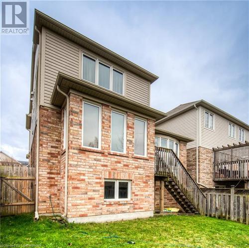 Rear view of house featuring a yard - 66 Abbott Crescent, Cambridge, ON - Outdoor