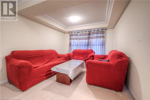 Living room with carpet, ornamental molding, and a raised ceiling - 66 Abbott Crescent, Cambridge, ON - Indoor