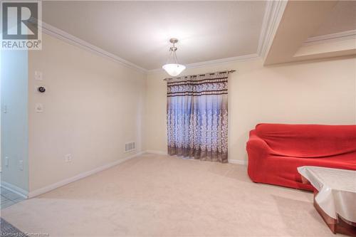 Sitting room with carpet flooring and crown molding - 66 Abbott Crescent, Cambridge, ON - Indoor Photo Showing Other Room