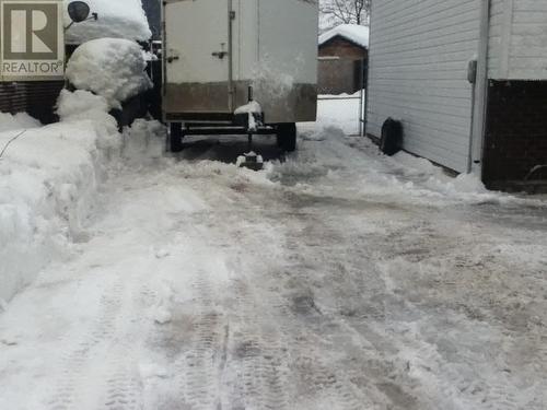 Winter Back Yard Entrance/Parking - 162 Pearkes Drive, Revelstoke, BC - Outdoor