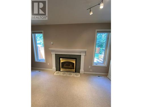 1517 Fir Crescent, Golden, BC - Indoor Photo Showing Living Room With Fireplace