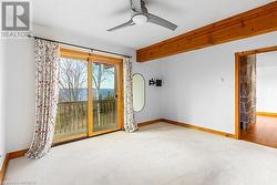 Main level master with water views and patio door walk out to private balcony. - 