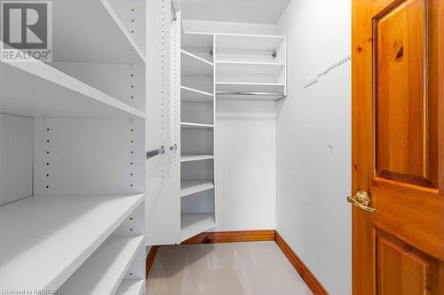 Master walk-in closet with custom cabinetry. - 92 Moore St, Lion'S Head, ON - Indoor