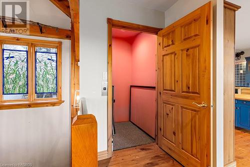 Elevator with natural wood doors matching the home interior. Elevator in 'as-is' condition. - 92 Moore St, Lion'S Head, ON - Indoor Photo Showing Other Room