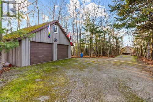 Large 24ft x 24ft garage with loft area. Driveway with ample parking. - 92 Moore St, Lion'S Head, ON - Outdoor