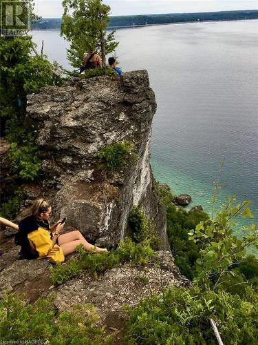 Take in the stunning views or look for the professional climbers below. - 92 Moore St, Lion'S Head, ON - Outdoor With Body Of Water With View