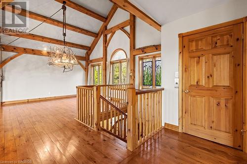 Up the staircase (or elevator) to the main level space between timber frame Great Room / Dining Room and Kitchen areas. - 92 Moore St, Lion'S Head, ON - Indoor Photo Showing Other Room