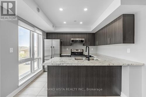 07 - 100 Dufay Road, Brampton, ON - Indoor Photo Showing Kitchen With Upgraded Kitchen