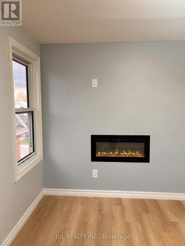 4750 Saint Lawrence Avenue E, Niagara Falls, ON - Indoor Photo Showing Other Room With Fireplace