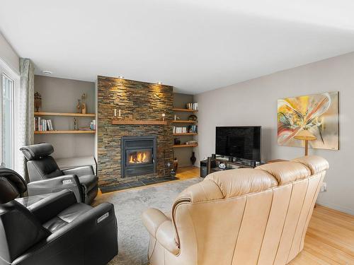 Salon - 404 Rue Des Sizerins, Lévis (Les Chutes-De-La-Chaudière-Ouest), QC - Indoor Photo Showing Living Room With Fireplace