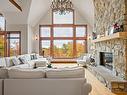 Salon - 525 Ch. De Cassiopée, Mont-Tremblant, QC  - Indoor Photo Showing Living Room With Fireplace 