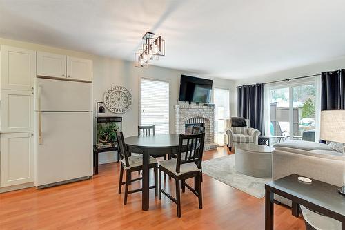 131-133 Wyndham Crescent, Kelowna, BC - Indoor Photo Showing Other Room With Fireplace