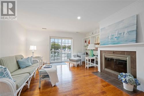 1500 Venetian Boulevard Unit# W-14, Point Edward, ON - Indoor Photo Showing Living Room With Fireplace