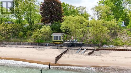 Shoreline protection with bunkie - 3394 Schram Drive W, Plympton-Wyoming (Plympton Wyoming), ON - Outdoor With Body Of Water