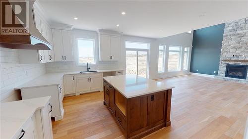 484 Julianna Court, Plympton-Wyoming, ON - Indoor Photo Showing Kitchen With Fireplace