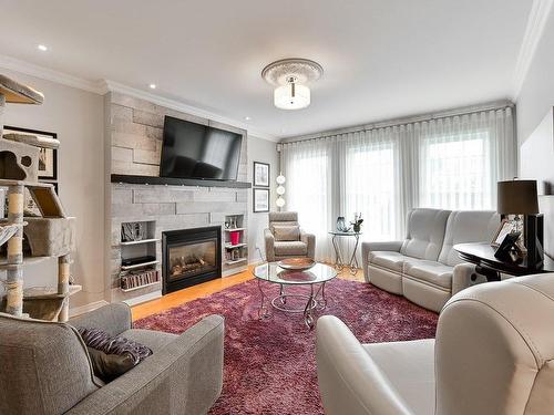 Living room - 712 Boul. N.-P.-Lapierre, Sainte-Julie, QC - Indoor Photo Showing Living Room With Fireplace