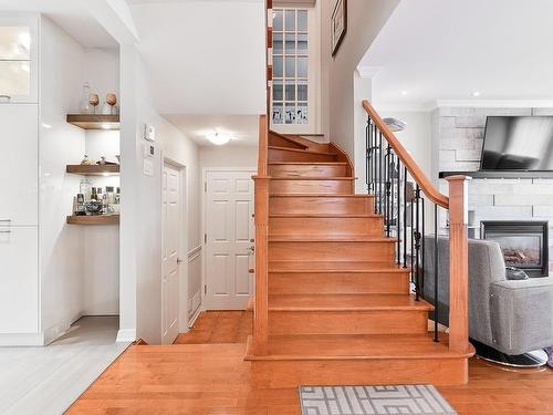 Staircase - 712 Boul. N.-P.-Lapierre, Sainte-Julie, QC - Indoor Photo Showing Other Room With Fireplace