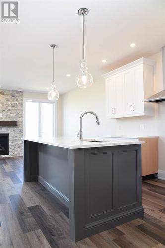 678 Ketter Way, Plympton-Wyoming, ON - Indoor Photo Showing Kitchen With Fireplace