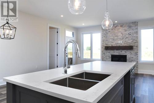 678 Ketter Way, Plympton-Wyoming, ON - Indoor Photo Showing Kitchen With Fireplace With Double Sink