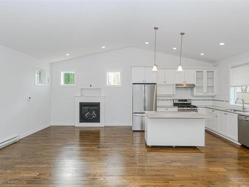 10296 Sparling Pl, Sidney, BC - Indoor Photo Showing Kitchen With Fireplace With Double Sink With Upgraded Kitchen