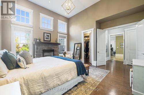 58 Garrison Village Drive, Niagara-On-The-Lake, ON - Indoor Photo Showing Bedroom With Fireplace