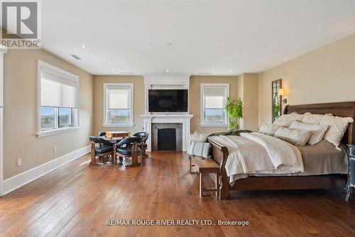 5785 Halls Road N, Whitby, ON - Indoor Photo Showing Bedroom With Fireplace