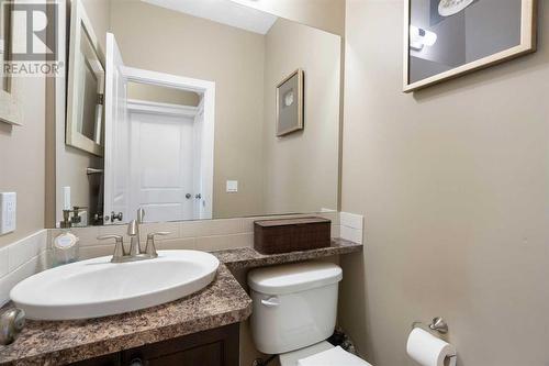 A sizable mudroom and a private half bath complete the main floor - 111 Sage Hill Green Nw, Calgary, AB 