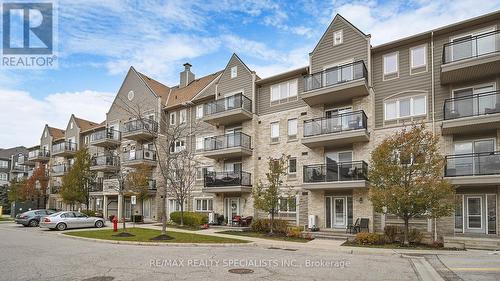 211 - 5100 Winston Churchill Boulevard, Mississauga, ON - Outdoor With Balcony With Facade