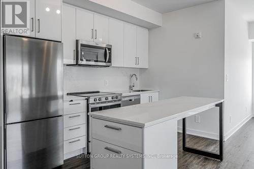 317 - 1440 Clarriage Court, Milton, ON - Indoor Photo Showing Kitchen With Stainless Steel Kitchen With Upgraded Kitchen