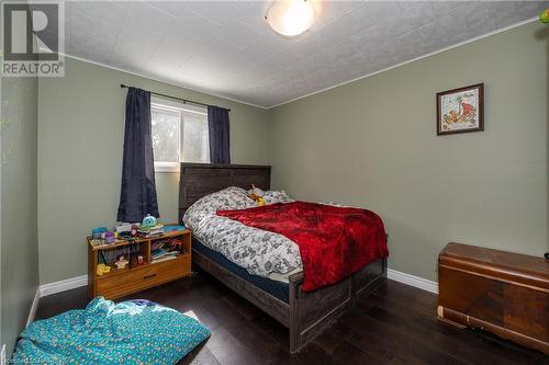 Bedroom with dark wood-type flooring and crown molding - 361 1St Avenue S, Chesley, ON - Indoor Photo Showing Bedroom