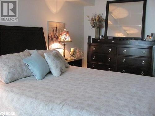 Bedroom with carpet floors - 150 E Dunlop Street E Unit# 605, Barrie, ON 