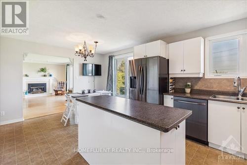 947 Lacroix Road, Clarence-Rockland, ON - Indoor Photo Showing Kitchen With Fireplace