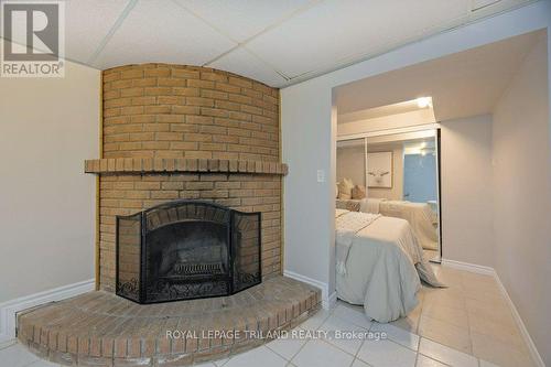 144 Baseline Road W, London, ON - Indoor Photo Showing Living Room With Fireplace