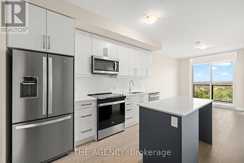 1207 - 3220 William Coltson Avenue, Oakville, ON - Indoor Photo Showing Kitchen With Stainless Steel Kitchen