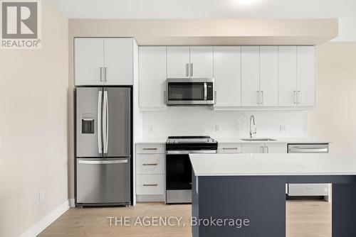 1207 - 3220 William Coltson Avenue, Oakville, ON - Indoor Photo Showing Kitchen With Stainless Steel Kitchen