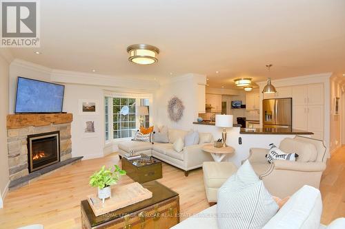 13 - 3333 New Street, Burlington, ON - Indoor Photo Showing Living Room With Fireplace