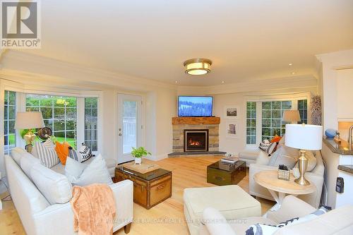 13 - 3333 New Street, Burlington, ON - Indoor Photo Showing Living Room With Fireplace