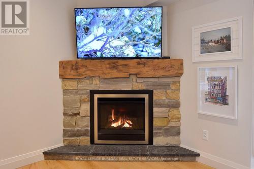 13 - 3333 New Street, Burlington, ON - Indoor Photo Showing Living Room With Fireplace