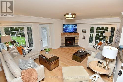 13 - 3333 New Street, Burlington, ON - Indoor Photo Showing Living Room With Fireplace