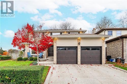 View of front of property with a garage - 2401 Coventry Way, Burlington, ON 