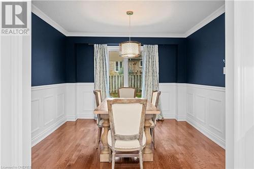 Dining room featuring ornamental molding and hardwood / wood-style floors - 2401 Coventry Way, Burlington, ON 