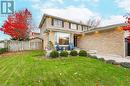 Rear view of house featuring a patio and a yard - 2401 Coventry Way, Burlington, ON 