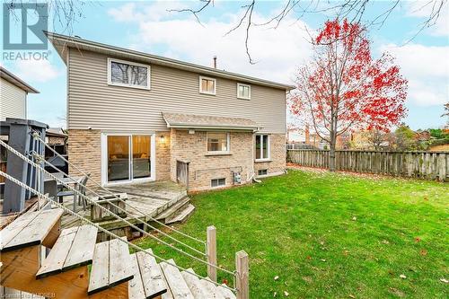 Back of house with a wooden deck and a yard - 2401 Coventry Way, Burlington, ON 