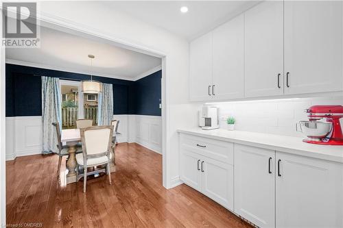 Dining room featuring light hardwood / wood-style floors and crown molding - 2401 Coventry Way, Burlington, ON 