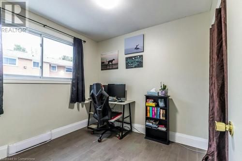 Office with baseboard heating and wood-type flooring - 48 Windom Road Unit# E, Kitchener, ON 